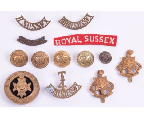 Badges and Insignia of the Royal Sussex Regiment, consisting of brass other ranks helmet plate centre, brass T/4/ROYAL SUSSEX