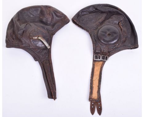 Two Pre WW2 American Flying Helmets, both in brown leather with cloth linings to the interior. One helmet has tailors label t