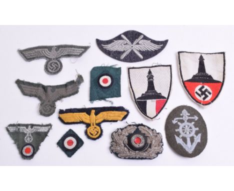 Selection of WW2 German Cloth Insignia, consisting of uniform removed army combat tunic breast eagle, late war embroidered tu