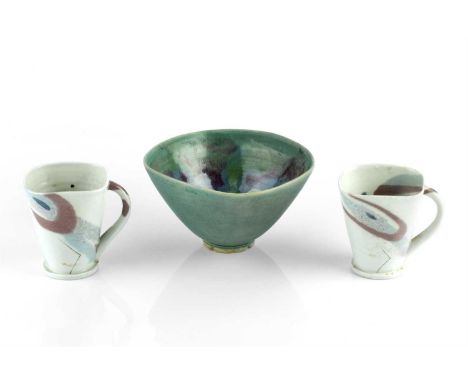 Janice Tchalenko (1942-2018)
Two cups and a bowl
decorated in pale browns, greens, and blues bowl
18cm diameter, cups 10cm hi