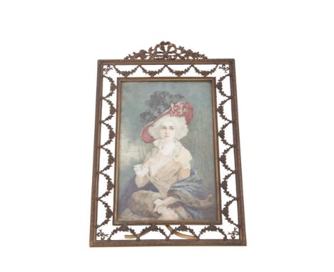 A CAST BRASS RECTANGULAR EASEL PICTURE FRAME, containing a lithographic portrait of a young woman. 26.7 x 18.4cm overall
