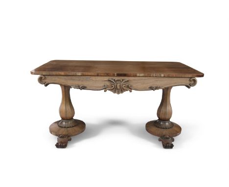 A COMPOSED MAHOGANY AND ROSEWOOD SOFA TABLE, basically 19th century, with plain top and shaped frieze on twin faceted baluste