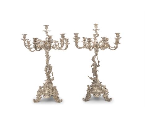 A FINE PAIR OF VICTORIAN SILVER PLATED CANDELABRA, each with ten candle sconces on scrolling branches, raised on an organic c