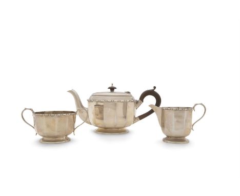 A THREE PIECE SILVER TEA SERVICE, Sheffield 1930, mark of George Wish Ltd, comprising teapot, cream jug and sugar bowl, each 