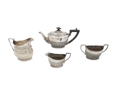A PART VICTORIAN SILVER COMPOSED THREE PIECE BACHELOR'S TEA SERVICE, London 1886 and Chester 1913, maker's marks rubbed, of o