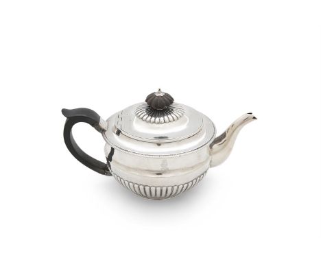 A LATE GEORGE III SILVER TEAPOT, London 1805, mark of Richard Cooke, of circular form, with shallow domed lid and timber fini