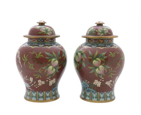 A PAIR OF CHINESE CLOISONNÉ ENAMELLED RUBY GROUND VASES AND COVERS, each with detachable top and domed finial, the baluster s