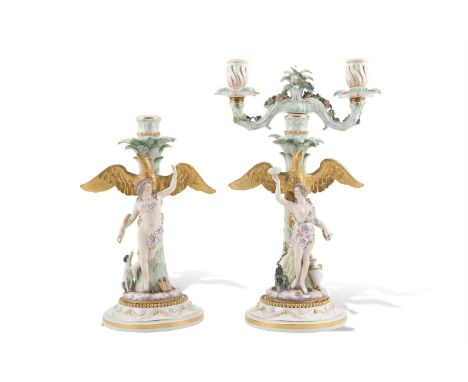 A PAIR OF MEISSEN PORCELAIN FIGURAL CANDELABRA, 19th century, modelled as Ganymede and Hebe, each standing against palm frond