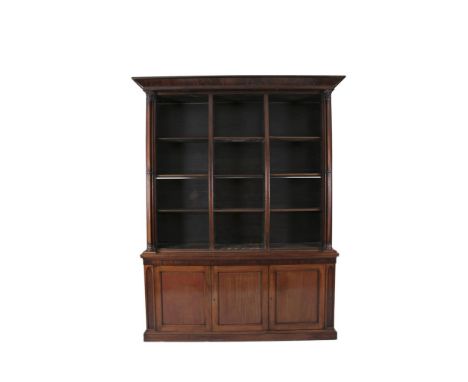 AN EARLY VICTORIAN MAHOGANY BOOKCASE, with architectural pediment above open shelving, flanked by cluster column pilasters, t