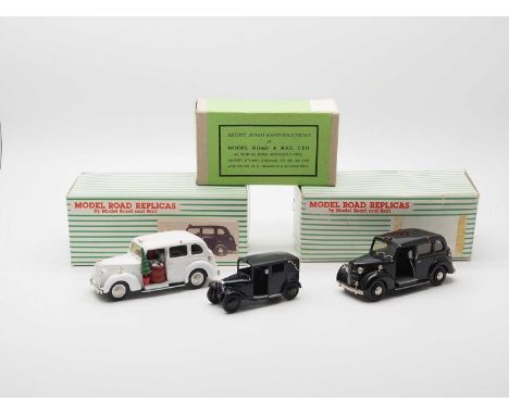 A trio of hand built white metal models by MODEL ROAD REPLICAS (SMTS), comprising a black Austin FX3, white Austin FX3 Father