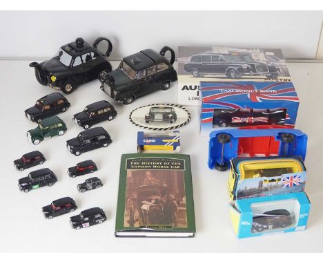 A mixed group of London Taxis items comprising assorted diecast models, two ceramic teapot Taxis , a book, a hand painted cer