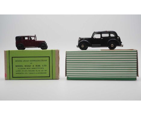 A pair of hand built white metal models by MODEL ROAD REPLICAS (SMTS), comprising a black Austin FX3 and a pre war Austin Tax