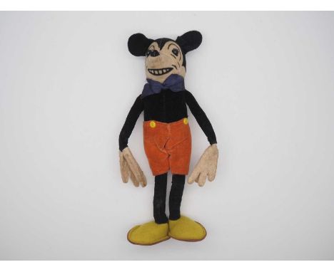 An early 1930s DEANS RAG BOOK COMPANY Mickey Mouse with black velvet body, cream face with printed features, boot button eyes