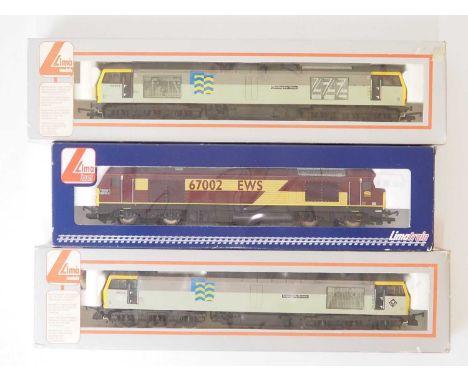 A group of LIMA OO gauge diesel locomotives, comprising a Class 67 in EWS livery and a pair of Class 60 in Railfreight livery