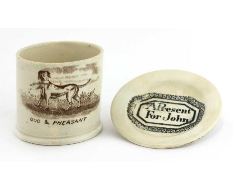 A child's pottery dish,early 19th century, printed 'A present For John' within a scrolling border,9cm diameter, anda mug,with