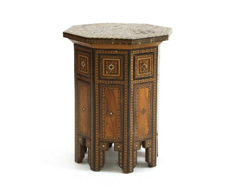 A Syrian parquetry, bone and mother-of-pearl inlaid table, 20th century, Damascus, of octagonal form, decorated all-over with