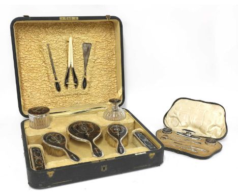 A tortoiseshell and silver dressing table vanity set,by Walker &amp; Hall, Birmingham 1922,consisting of ten items, each deco