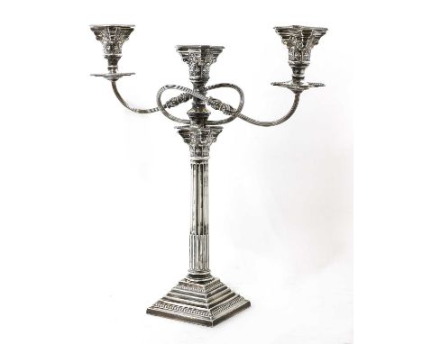 A George V silver three-light Corinthian column candelabrum, by William Adams Ltd., Birmingham 1933,the removable twin scroll