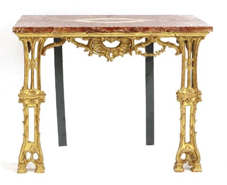 A carved giltwood console table,in the manner of Thomas Chippendale, George III and later, the red book matched top over a sw