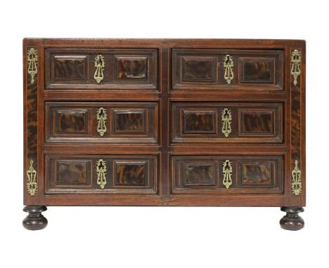 A Spanish rosewood and inlaid table cabinet of drawers,18th century and later, the panelled drawer fronts inlaid with tortois
