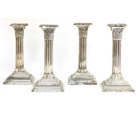 A set of four silver candlesticks,by Hunt &amp; Roskell, Late Storr &amp; Mortimer, London 1891,the Corinthian columns with d