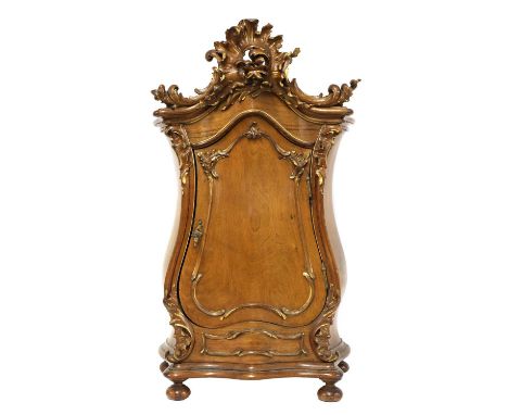 A miniature Continental armoire or table cabinet,  20th century, possibly Venetian, of bombé form, having an ornate carved an