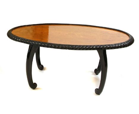 A Ceylonese ebony and satinwood oval table,90cm wide 60cm deep36cm high