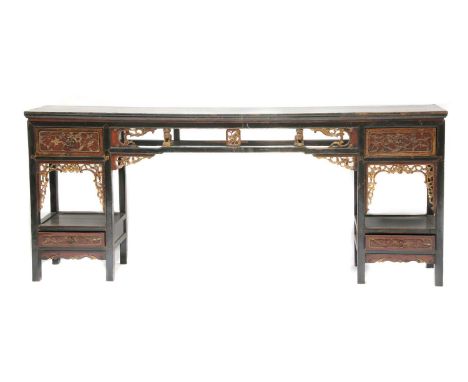 A Chinese lacquered altar table,late 19th century, the supports to each end with a single drawer over a recess and a further 