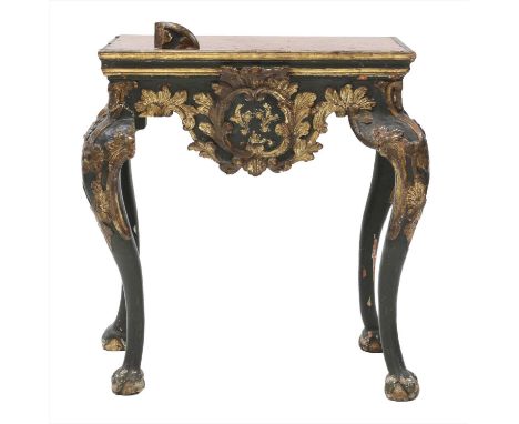 An Italian carved, painted and gilt pier table,18th century, with an inset rouge marble top above a shaped apron with scrolli