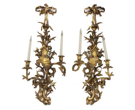 A pair of Chippendale-style carved giltwood wall sconces,20th century, with twin scrolling branches and pagoda detail, 89cm l
