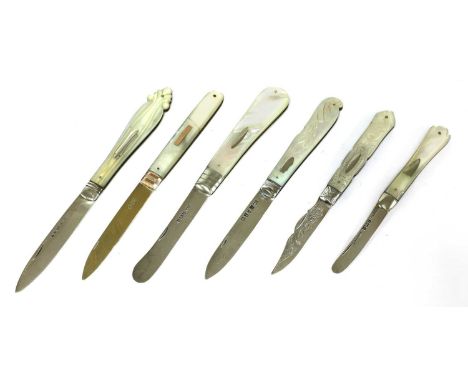 Six silver and mother-of-pearl folding fruit knives,the first, with lion passant and duty marks (only) with silver gilt blade