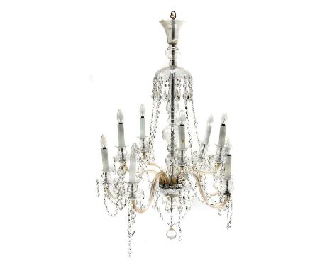 A cut-glass ten-light electrolier, 20th century, with scrolling branches suspending swags and lustre drops,115cm highProvenan