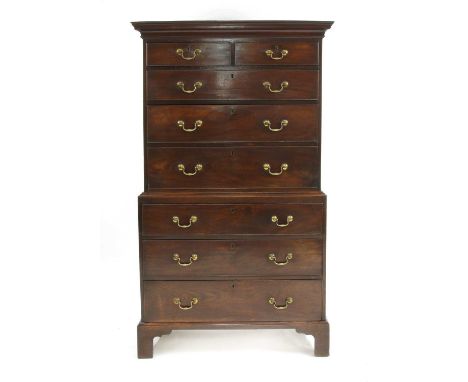 A George III mahogany chest on chest,the upper section with a moulded pediment over two short and three long drawers, the bas