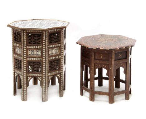 An Eastern octagonal low table,20th century, inlaid with simulated ivory and mother-of-pearl, and set with pierced panels, 45