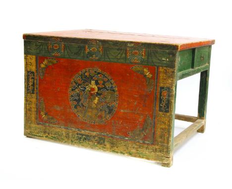 A polychrome painted Tibetan altar table, first half of the 20th century, the front panel decorated with a figure and a drago