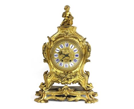 A French ormolu mantel clock,late 19th century, the elaborate floral and foliate scroll decorated case, surmounted by a putto