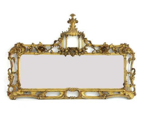 A carved giltwood wall mirror,19th century, in the Chinese Chippendale style, the rectangular plate within a border carved wi