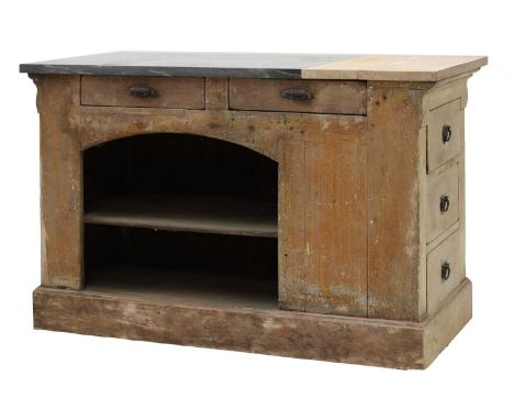 A French pine boulangerie counter,early 20th century and later, the marble slab top over drawers and open shelves, and on a p