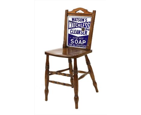 A walnut advertising chair,late 19th century, the back set with an enamel plaque, inscribed 'Watson's Matchless Cleanser is t