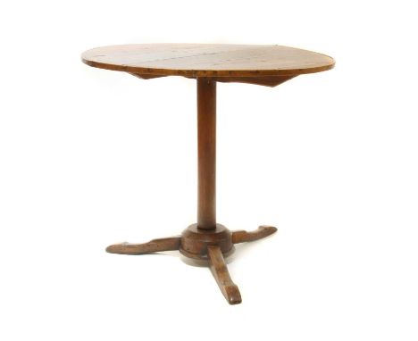 A Continental fruitwood pedestal table,18th century, with a beaded plank top on a plain column and tripod base,79cm diameter6