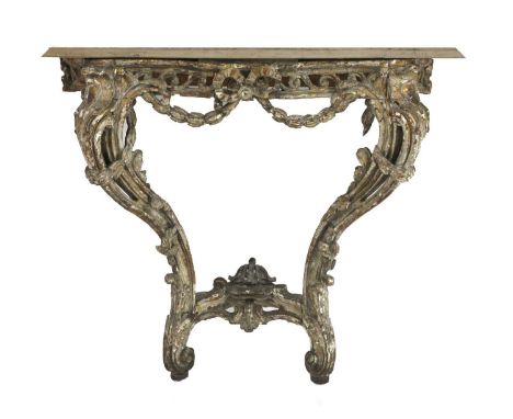 A marble-topped giltwood console table,19th century, the shaped top over a pierced and carved base, on scrolling supports uni