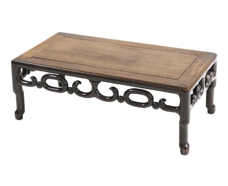 A Chinese hardwood low table,19th/20th century, with a carved and pierced frieze,76cm wide40cm deep28cm highCondition report: