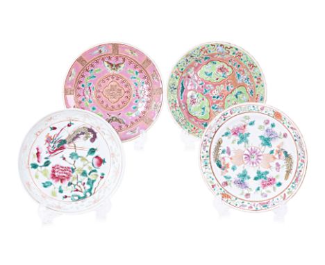 A GROUP OF FOUR FAMILLE ROSE SIDE PLATES Pink ground decorated with butterflies and peonies, quatrefoil central medallion wit