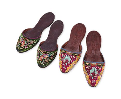 TWO PAIRS OF EMBROIDERED SLIPPERS
One pair decorated with birds and flowers on green background, the other with qilin on purp