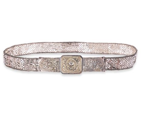 AN ARTICULATED SILVER BELT WITH BUCKLE
Silver, repousse decorated buckle with crab at centre, pin and clip mechanism, decorat