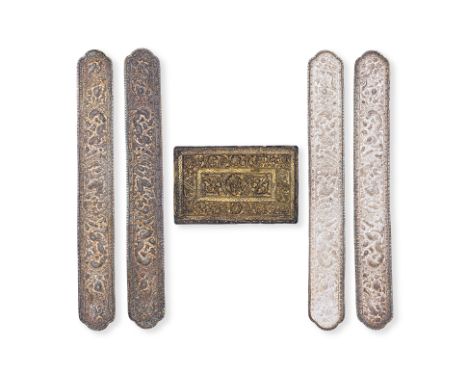 A GROUP OF FIVE PILLOW ENDS
Two pairs, slim rectangular quatrefoil shape, repousse decoration with central panel of qilin in 