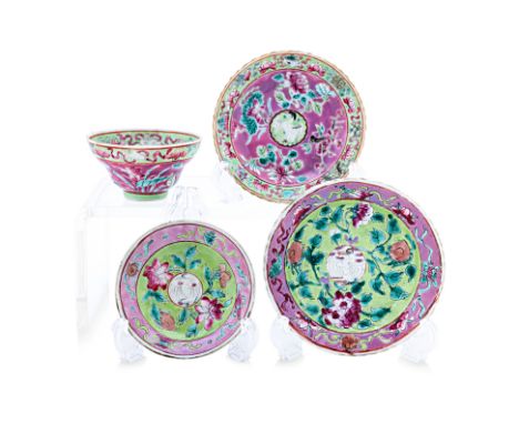 A GROUP OF FAMILLE ROSE 'CRANE' SAUCERS AND A TEA BOWL The saucers decorated with peonies on pink and green ground and cranes