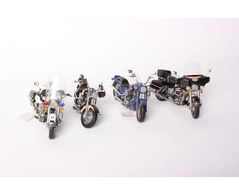 Four Franklin Mint Harley-Davidson 1:10 scale diecast model motorcycles - Biker Blues, Fat Boy, Electra Glide and Police Edit