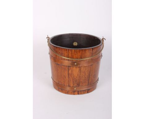 An R A Lister & Co brass bound oak coal bucket with swing handle and tin liner, 43cm h, ivorine trade label of R A LISTER & C