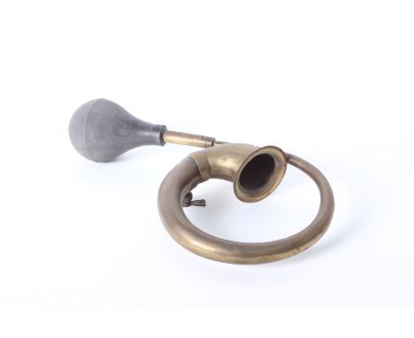 A Lion Brand brass car horn 43cm length, together with an RAC Royal Automobile Club Enamel radiator badge and telephone box k
